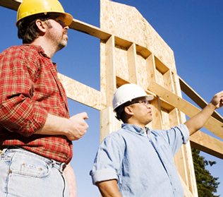 Two men talking on construction site